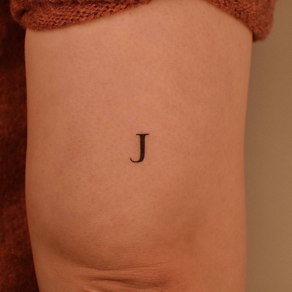 Minimalistic Letter J Tattoo Located On The Tricep Minimalistic Letter J Tattoo Located On The Tricep